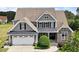 Charming two-story home with a two car garage and manicured landscaping at 10 Princeton Manor Dr, Youngsville, NC 27596
