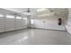 Spacious two-car garage with epoxy flooring, storage racks, and ample lighting at 10 Princeton Manor Dr, Youngsville, NC 27596