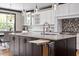 Granite kitchen island with seating, stainless steel appliances, and custom cabinets at 10 Princeton Manor Dr, Youngsville, NC 27596