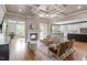 Spacious living room showcasing a fireplace, modern furnishings, and access to the kitchen at 10 Princeton Manor Dr, Youngsville, NC 27596