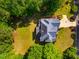 A top-down aerial view shows an expansive lawn and a home's blue roof at 100 Panoramic Ct, Cary, NC 27519
