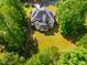 High-angle aerial view showcases the green lawn and home exterior features at 100 Panoramic Ct, Cary, NC 27519