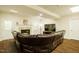 Finished basement with fireplace, sofa, and a door to the exterior at 100 Panoramic Ct, Cary, NC 27519