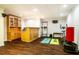 Finished basement with bar area, exercise equipment, and vinyl flooring at 100 Panoramic Ct, Cary, NC 27519