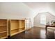Versatile bonus room with hardwood floors, lots of open space, and a window at 100 Panoramic Ct, Cary, NC 27519