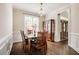 Cozy dining room featuring wainscotting and stylish furnishings at 100 Panoramic Ct, Cary, NC 27519