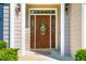 A welcoming front entrance featuring a decorative glass door and stylish wall-mounted lanterns at 100 Panoramic Ct, Cary, NC 27519