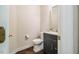 Stylish half bathroom featuring a modern vanity with a granite countertop and sleek fixtures at 100 Panoramic Ct, Cary, NC 27519