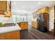 Spacious kitchen featuring wood cabinets, quartz countertops, stainless appliances, and a breakfast nook at 100 Panoramic Ct, Cary, NC 27519