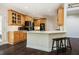 Open kitchen showcasing a central island with seating and a breakfast bar, perfect for casual dining at 100 Panoramic Ct, Cary, NC 27519