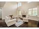 Bright living room with a fireplace, hardwood floors, and abundant natural light at 100 Panoramic Ct, Cary, NC 27519