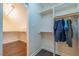 Spacious walk-in closet with shelves and hanging rods for organized storage at 100 Panoramic Ct, Cary, NC 27519