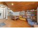 Finished attic area with wood-paneled ceiling, storage, and space for flexible living at 1000 Phils Creek Rd, Chapel Hill, NC 27516