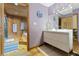 Stylish bathroom with wood paneled tub/shower and modern vanity at 1000 Phils Creek Rd, Chapel Hill, NC 27516