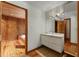 This bright bathroom includes a wide sink with storage and an attached room with a wooden hot tub at 1000 Phils Creek Rd, Chapel Hill, NC 27516