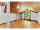 Bedroom with wood ceiling, window and built-in shelves at 1000 Phils Creek Rd, Chapel Hill, NC 27516