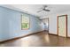 Light blue bedroom with window, closet, and ceiling fan at 1000 Phils Creek Rd, Chapel Hill, NC 27516