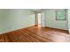 Simple bedroom with light green walls and wood floors at 1000 Phils Creek Rd, Chapel Hill, NC 27516