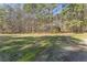 Gravel driveway leading to a secluded home surrounded by lush greenery at 1000 Phils Creek Rd, Chapel Hill, NC 27516