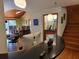 Inviting home entry with wood stairs, unique bar, and adjoining living room and dining room at 1000 Phils Creek Rd, Chapel Hill, NC 27516