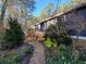 Charming home exterior with well-manicured landscaping and inviting brick pathway at 1000 Phils Creek Rd, Chapel Hill, NC 27516