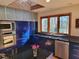 Contemporary kitchen featuring stainless steel appliances, custom cabinets, and a sunlit window at 1000 Phils Creek Rd, Chapel Hill, NC 27516