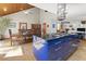 Spacious kitchen with a large island, adjacent to a formal dining area, and a wood-paneled ceiling at 1000 Phils Creek Rd, Chapel Hill, NC 27516