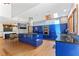Bright kitchen with blue cabinets, stainless appliances, island, and wood floors at 1000 Phils Creek Rd, Chapel Hill, NC 27516