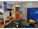 Bright kitchen with stainless steel refrigerator, modern cabinets, and connected breakfast nook at 1000 Phils Creek Rd, Chapel Hill, NC 27516