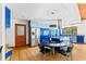A spacious kitchen features blue cabinets, stainless appliances, an island, and wood floors at 1000 Phils Creek Rd, Chapel Hill, NC 27516