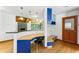 Living space with desk, entry door, and view of a fireplace at 1000 Phils Creek Rd, Chapel Hill, NC 27516