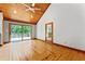 Bright room with wooden ceiling and floors, sliding glass doors to the outdoor deck at 1000 Phils Creek Rd, Chapel Hill, NC 27516
