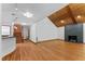 Bright living room with hardwood floors, wooden ceiling and sleek black fireplace at 1000 Phils Creek Rd, Chapel Hill, NC 27516