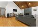 Cozy living room featuring a wood ceiling, hardwood floors, and a modern fireplace at 1000 Phils Creek Rd, Chapel Hill, NC 27516