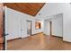 Spacious living room with wood ceiling and floors, and large window at 1000 Phils Creek Rd, Chapel Hill, NC 27516