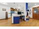 Unique office space boasts blue and white built-in desk with hardwood floors at 1000 Phils Creek Rd, Chapel Hill, NC 27516