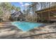 Backyard pool and pool house offering both relaxation and entertainment options at 1000 Phils Creek Rd, Chapel Hill, NC 27516
