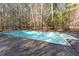Sparkling backyard pool with surrounding wrought iron fence, creating a private oasis at 1000 Phils Creek Rd, Chapel Hill, NC 27516