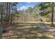 Decorative sign marking the entrance to a tree-lined property at 1000 Phils Creek Rd, Chapel Hill, NC 27516