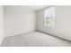 Bedroom featuring neutral carpet and one window at 1012 Old Evergreen Dr, Durham, NC 27704