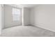 A room with carpet, one window and a ceiling light at 1012 Old Evergreen Dr, Durham, NC 27704