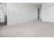 Spacious bedroom with plush carpet, leading to a bathroom at 1012 Old Evergreen Dr, Durham, NC 27704