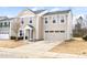 Traditional two-story house with a two-car garage, and inviting front entrance at 1012 Old Evergreen Dr, Durham, NC 27704