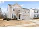 Inviting two-story house featuring a two-car garage and classic architectural details at 1012 Old Evergreen Dr, Durham, NC 27704