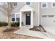 Welcoming front entrance with a stylish black door and covered porch at 1012 Old Evergreen Dr, Durham, NC 27704