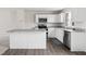 Kitchen with an island, stainless steel appliances, and white cabinets at 1012 Old Evergreen Dr, Durham, NC 27704