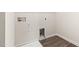 Empty laundry room showcasing hookups and vinyl floors at 1012 Old Evergreen Dr, Durham, NC 27704