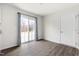 Bright room with vinyl wood flooring and sliding glass doors to the outside at 1012 Old Evergreen Dr, Durham, NC 27704