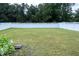 Large, grassy backyard with white fence at 1016 Matterhorn Dr, Fuquay Varina, NC 27526