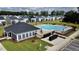 Community pool with lounge chairs, tables, and a building at 1016 Matterhorn Dr, Fuquay Varina, NC 27526